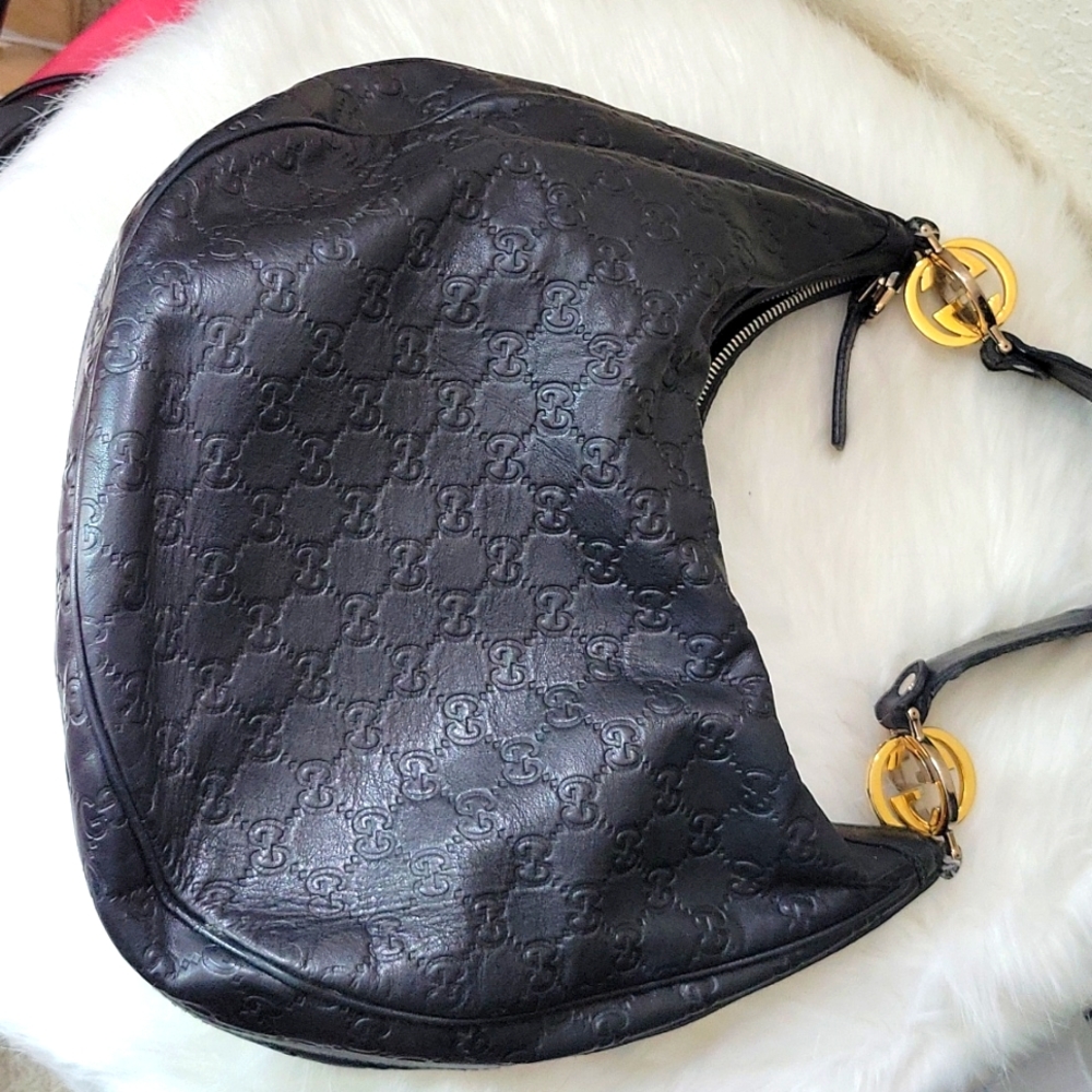 Authentic Gucci Double G handbag. Embossed leather